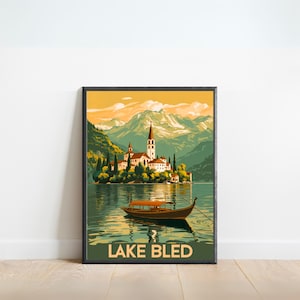 May include: A vintage travel poster featuring a scenic view of Lake Bled in Slovenia. The poster depicts a small island with a church on it, surrounded by mountains and a lake. A wooden boat is in the foreground, with the text "LAKE BLED" at the bottom.