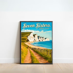 Puede incluir: Un póster enmarcado con un diseño de cartel de viaje vintage. El póster representa los acantilados de Seven Sisters en Inglaterra, con un camino que conduce a la playa. El cielo es azul con nubes y el mar es turquesa. El texto "Seven Sisters, England" es visible.