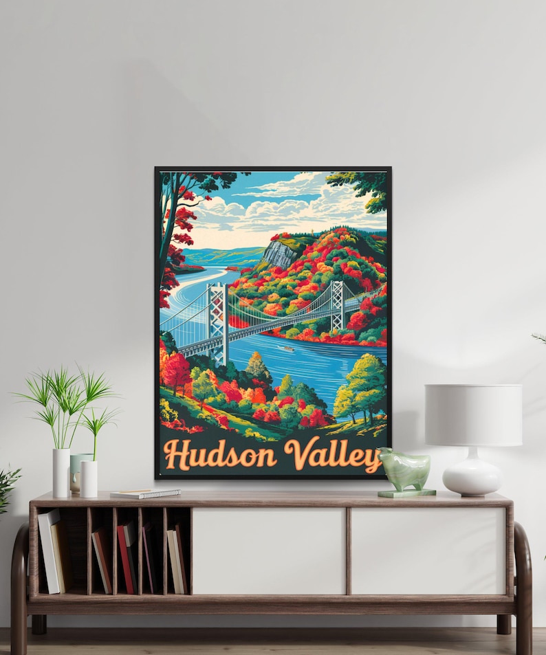 May include: A vintage-style travel poster featuring a scenic view of the Hudson Valley with a bridge crossing the river. The poster has a blue, green, and orange color scheme and the text "Hudson Valley" in a retro font.