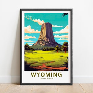 May include: A vintage-style travel poster featuring a colourful illustration of Devils Tower National Monument in Wyoming, United States. The poster has a blue sky with white clouds, a green grassy field, and a brown rock formation.