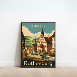 May include: A vintage travel poster depicting a colourful illustration of the town of Rothenburg ob der Tauber in Germany. The poster has a blue, green and yellow colour scheme and features a classic car driving down a cobbled street.
