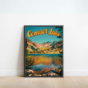 May include: A vintage-style travel poster featuring a scenic view of Convict Lake in California. The poster has a blue sky, green mountains, and a clear blue lake with a reflection of the mountains. The text "Convict Lake" is in a yellow, retro font.