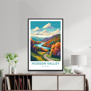 May include: A colorful illustration of a landscape with a river winding through a valley. The trees are in shades of orange, red, and yellow, and there is a small house in the distance. The text "HUDSON VALLEY NEW YORK" is at the bottom of the image.