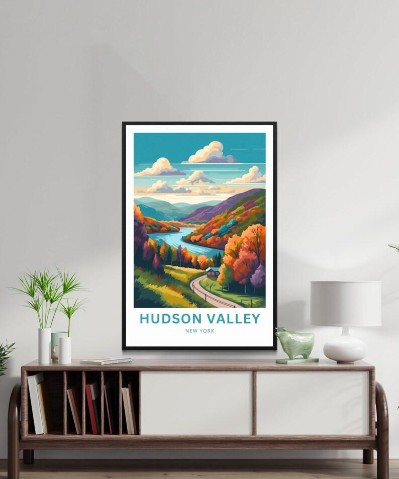 May include: A colorful illustration of a landscape with a river winding through a valley. The trees are in shades of orange, red, and yellow, and there is a small house in the distance. The text "HUDSON VALLEY NEW YORK" is at the bottom of the image.