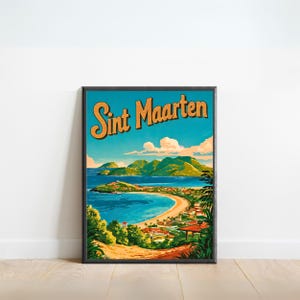 May include: A framed vintage travel poster for Sint Maarten. The poster features a coastal landscape with a sandy beach, turquoise water, green hills, and the text "Sint Maarten" in orange. The sky is a bright blue with fluffy white clouds.