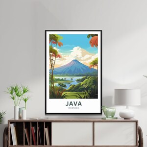 May include: A framed art print featuring a scenic view of Java, Indonesia. The artwork depicts a mountain, a lake, and lush greenery under a blue sky with clouds. The word "JAVA" and "INDONESIA" are printed at the bottom.