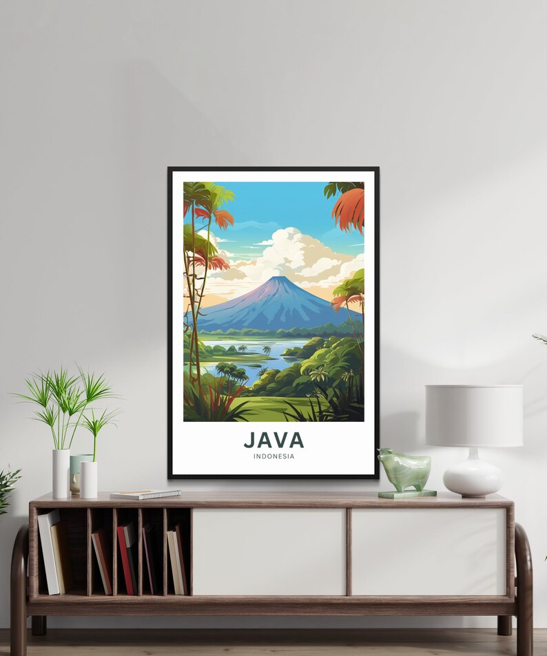 May include: A framed art print featuring a scenic view of Java, Indonesia. The artwork depicts a mountain, a lake, and lush greenery under a blue sky with clouds. The word "JAVA" and "INDONESIA" are printed at the bottom.