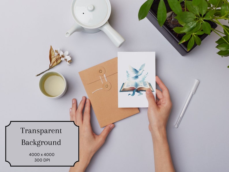May include: A white card with a watercolor illustration of two doves flying out of an open book. The book is blue and gold with a blue ribbon. The card is being held by a person's hands.
