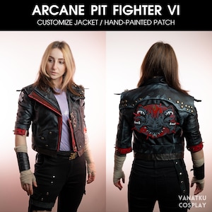May include: A black leather jacket with red accents and a hand-painted patch featuring a three-headed monster. The jacket has a zipper closure and a collar. The patch is on the back of the jacket. The jacket is worn by a person with brown hair. The text "ARCANE PIT FIGHTER VI" and "CUSTOMIZE JACKET / HAND-PAINTED PATCH" is at the top of the image.