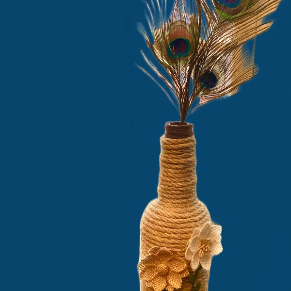 Alcohol Bottle Wrapped with Hemp Rope and Decorated with Burlap Flowers and Peacock Feathers ON SALE