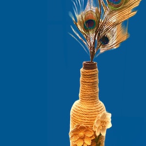 Alcohol Liqueur Bottle Wrapped with Hemp Rope and Decorated with Burlap Flowers and Peacock Feathers Wrapped Wine Bottle