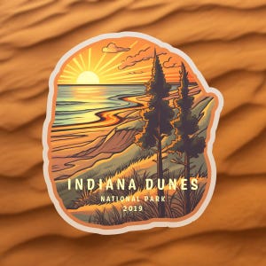 May include: A sticker featuring a sunset over a beach with two pine trees in the foreground. The text "Indiana Dunes National Park 2019" is at the bottom of the sticker.