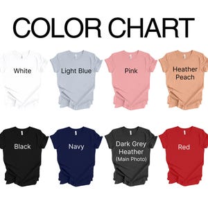 May include: Color chart showing 10 different t-shirt colors: white, light blue, pink, heather peach, black, navy, dark grey heather, red, light green heather, and dark green heather. The text "COLOR CHART" is at the top of the image.