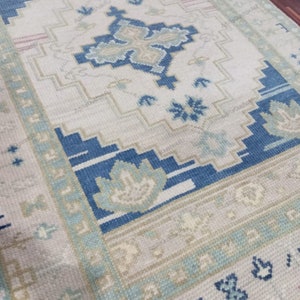Hand Knotted Wool Oushak Rug: Pastel Turkish Vintage Area Rug