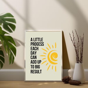 May include: A motivational quote poster with a yellow sun graphic. The quote reads "A little progress each day can add up to big result".