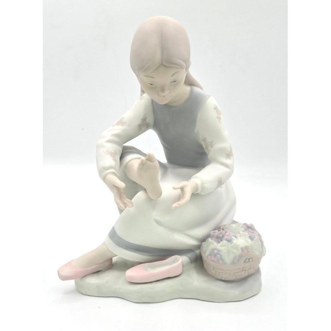 NAO by Lladró Spanish Porcelain Figurine – Seated Girl With Flower