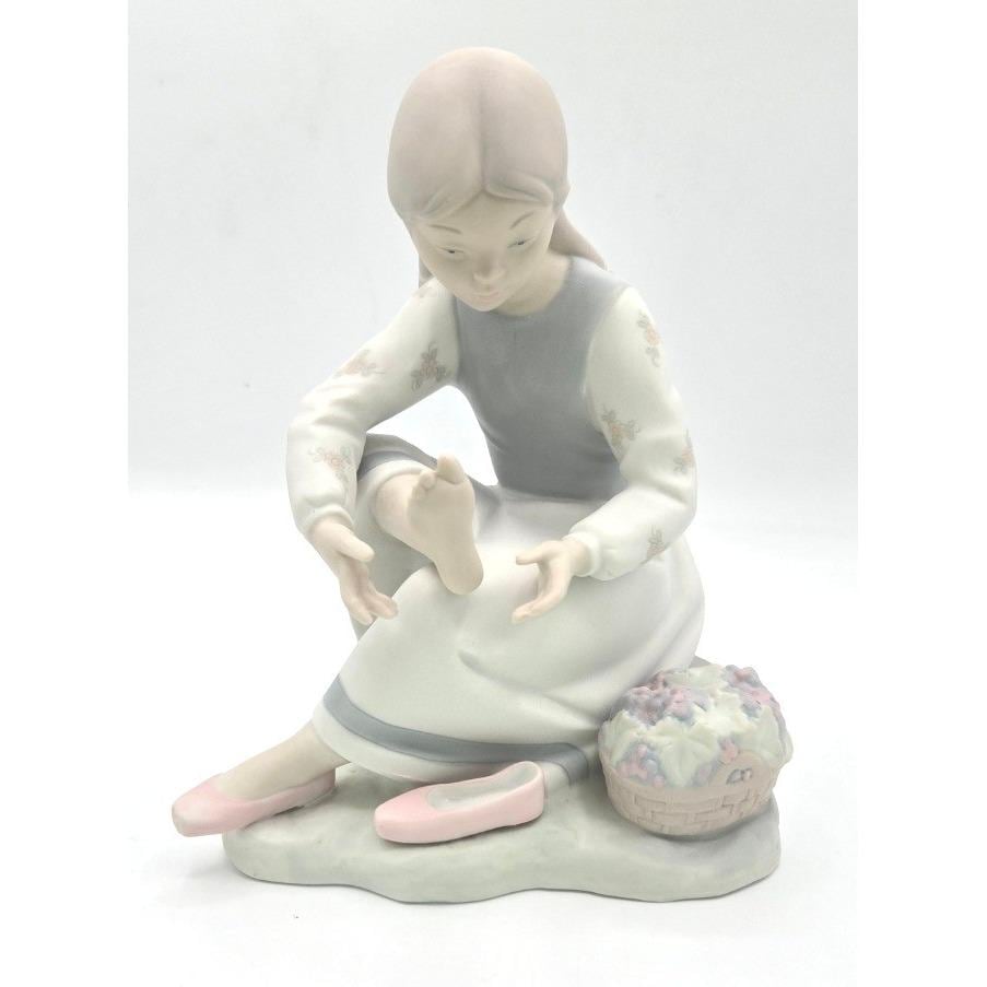 NAO by Lladró Spanish Porcelain Figurine – Seated Girl With Flower