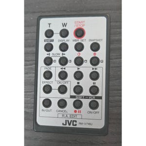 May include: A rectangular JVC RM-V716U remote control with numerous black buttons and white text. The top section has a red "START/STOP" button. The remote has buttons for "SHIFT", "DISPLAY", "SLOW", "FADE", and "EFFECT".