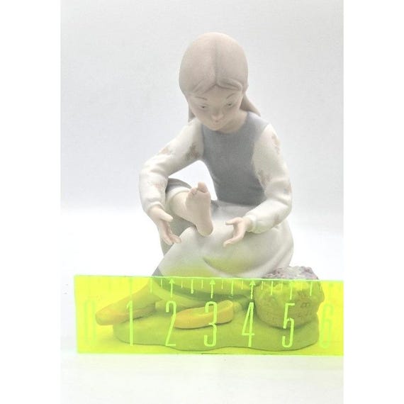 NAO by Lladró Spanish Porcelain Figurine – Seated Girl With Flower