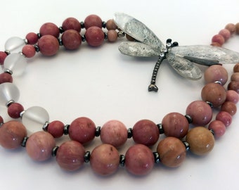 Rhodonite beads with dragonfly and hematite inserts.