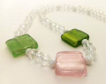 Beads made of glass squares and transparent rondels.