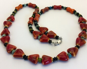 Beads with ceramic triangles