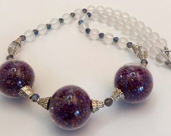 Necklace with balls,_filled with beads
