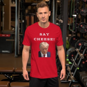 Funny Political Mug Shot T-Shirt: &quot;Say Cheese&quot; Graphic Tee