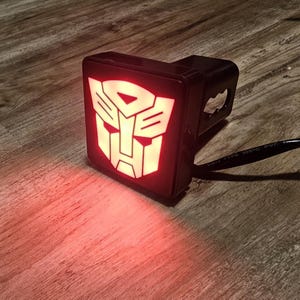 3D Printed LED Autobots Hitch Cover – Transformers Inspired Truck Brake Light