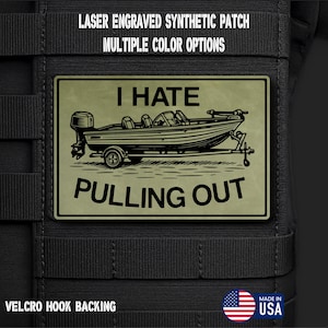 May include: A rectangular patch with the text "I HATE PULLING OUT" and a boat graphic. The patch is olive green with black text and a black boat illustration. The patch has the text "LASER ENGRAVED SYNTHETIC PATCH MULTIPLE COLOR OPTIONS" at the top and "VELCRO HOOK BACKING" at the bottom.