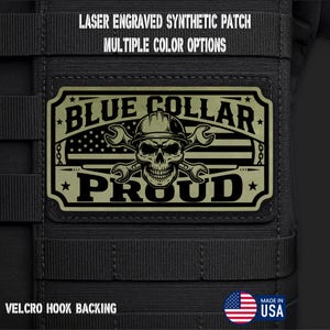May include: A rectangular olive green synthetic patch with a black laser-engraved design featuring a skull wearing a hard hat, crossed wrenches, and an American flag motif. The text reads BLUE COLLAR PROUD. It includes a Velcro hook backing.