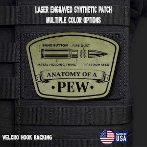 May include: A laser-engraved synthetic patch with multiple color options. The patch features an illustration of a bullet with labeled parts: "Bang Button," "Fire Dust," "Metal Holding Thing," and "Freedom Seed." The text "Anatomy of a Pew" is also included. The patch has Velcro hook backing and is made in the USA.