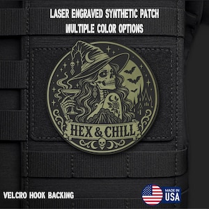 May include: A circular laser-engraved synthetic patch with Velcro hook backing. The design features a skeleton wearing a witch hat, holding a glass, with bats and a castle silhouette. Text reads: LASER ENGRAVED SYNTHETIC PATCH, MULTIPLE COLOR OPTIONS, HEX & CHILL.