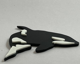 Four 3D printed orca, also called killer whale fridge magnets, powerful holding power.