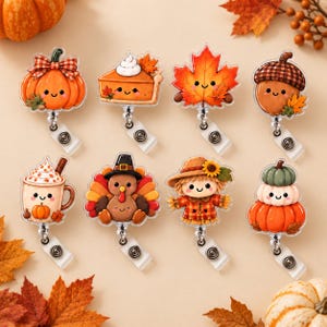 May include: A set of eight acrylic badge reels featuring cute autumn-themed designs including a pumpkin, a slice of pie, a maple leaf, an acorn, a pumpkin spice latte, a turkey, a scarecrow, and a stack of three pumpkins, each with a metal clip.