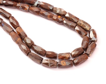 May include: A strand of brown and gray faceted gemstone beads. The beads are long and rectangular in shape.