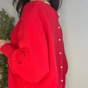 Red jumper hotsell with pearls