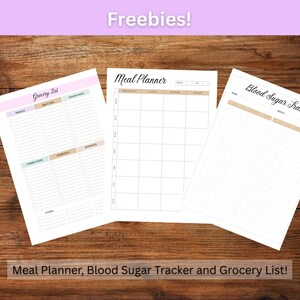 May include: Three printable sheets: a grocery list, a meal planner, and a blood sugar tracker. The sheets are white with black text and brown lines. The text "Freebies!" is at the top of the image in purple text.