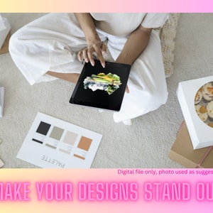 May include: A person is using a tablet to view a design on a screen. The tablet is on a white surface with a color palette and the text "PALETTE" written on it. The design on the screen is a watercolor painting of a landscape.