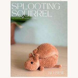 May include: A crocheted squirrel in shades of brown, lying on a wooden surface. The squirrel has small ears, a round body, and a tiny tail. Text on the image reads "SPLOOTING SQUIRREL" and "PATTERN by @crochet_CroChey". The words "NO SEW" are also visible.