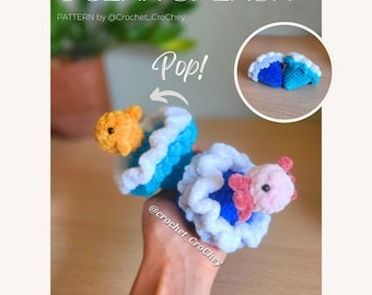 Ocean Splash POPs PDF crochet pattern, biginner friendly no-sew amigurumi, poppable fidget axolotl and clown fish inside a blue wave.