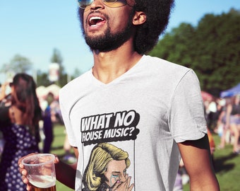 May include: A white V-neck t-shirt with a graphic print of a woman crying with the text "WHAT NO HOUSE MUSIC?" in a comic book style.
