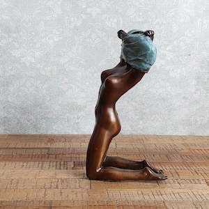 Bronze Sculpture: Sensual Female Figurine Elegant Artistic Representation of a Woman Undressing Modern Provocative Art Piece