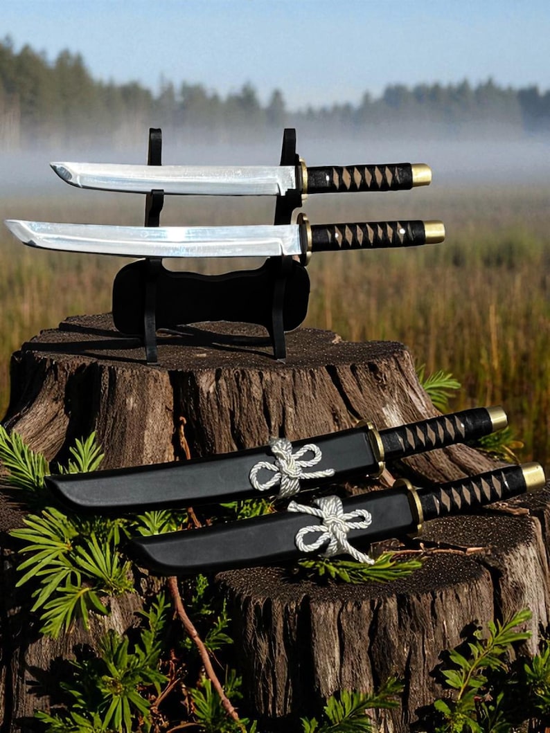 May include: Two katana swords with black handles and silver blades are displayed on a black stand. Two additional swords in black sheaths are tied with white rope. The swords are on a tree stump.