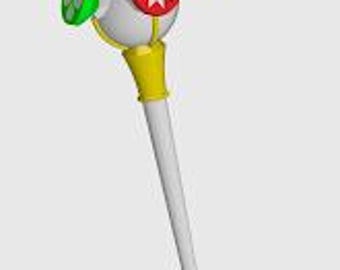 May include: A white and yellow scepter with a round, white orb at the top. The orb has a red star, a green clover, a blue circle, and a yellow circle attached to it.