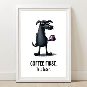 May include: Framed art print featuring a black cartoon dog holding a pink coffee mug. The dog has a sleepy expression. The text "COFFEE FIRST. Talk later." is printed below the dog in bold, black font.