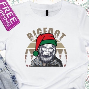 Bigfoot Christmas Holiday, Funny Sasquatch Christmas, Squatching Bigfoot Xmas Tree Light shirt, Bigfoot Carrying Christmas Tree shirt