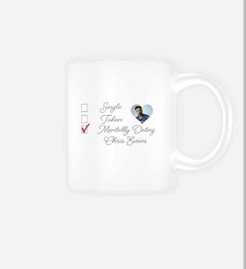 May include: White ceramic mug with a checklist and a heart featuring a photo of Chris Evans. The checklist has three options: Single, Taken, Mentally Dating Chris Evans. The box next to Mentally Dating Chris Evans is ticked.