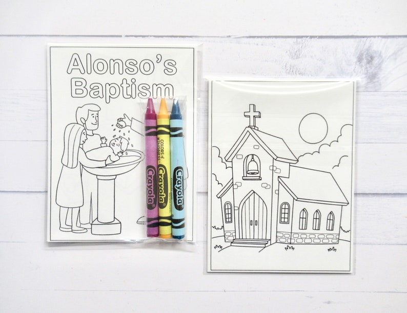 May include: A coloring book set for a baptism with a black and white illustration of a baptism and a church. The set includes four crayons in pink, yellow, blue, and green. The coloring book cover has the text "Alonso's Baptism".