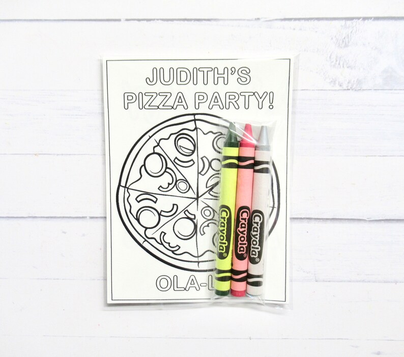 May include: A coloring page featuring a pizza with the text "Judith's Pizza Party!" and "Ola-L" at the bottom. Three Crayola crayons are included: green, pink, and white.